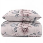 Duvet cover and two pillow cases with a pink floral pattern on a pale pink background.
