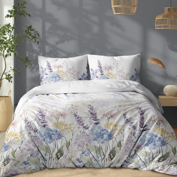 Queen bed with white floral duvet and pastel lavender, blue, and yellow pillows; grey wall and wooden floor.