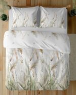 Top-view of a bed with white duvet and pillows featuring beige grasses and small butterflies.